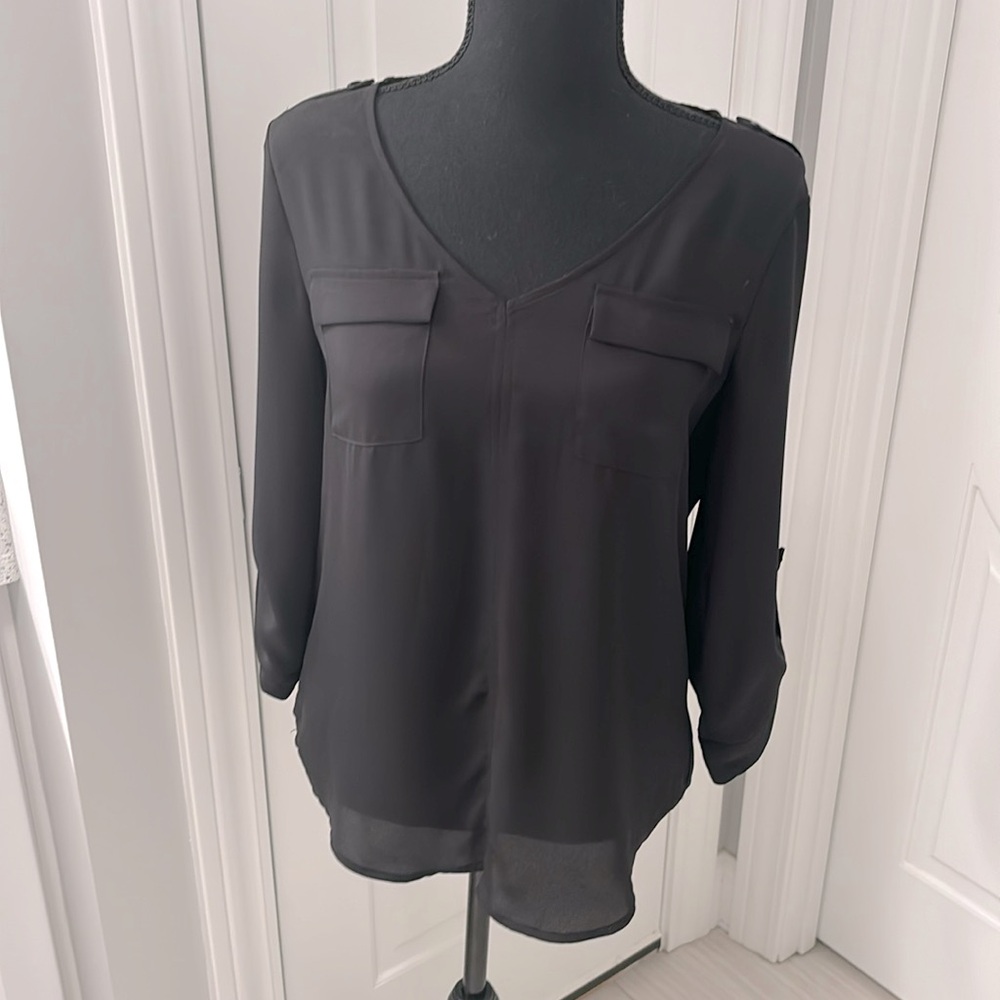 Black V Neck Blouse with pocket detail front and lace back. Size M